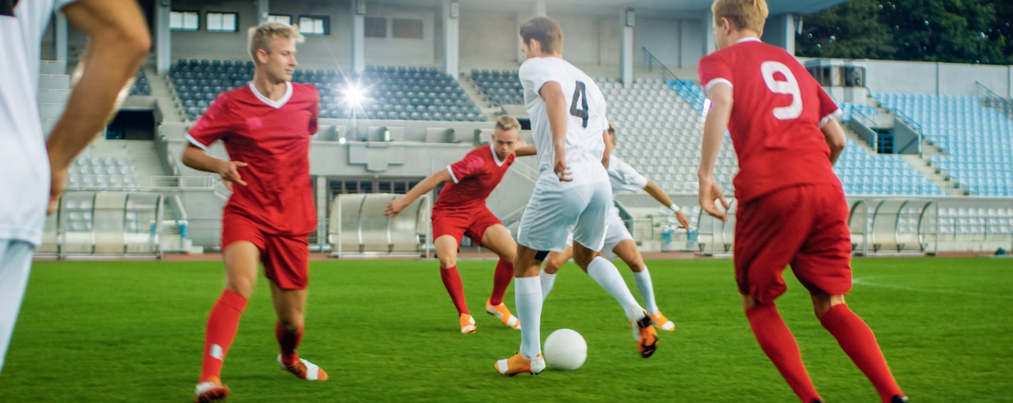 Player dribbling past team