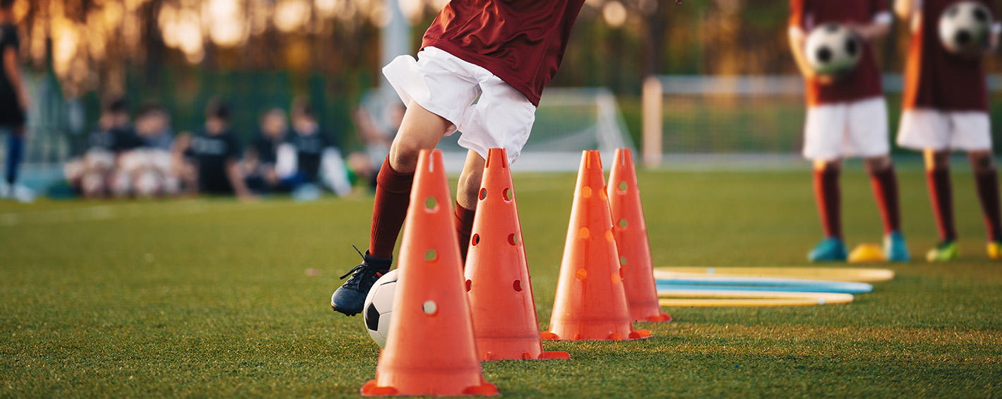 Players warm up for soccer trials