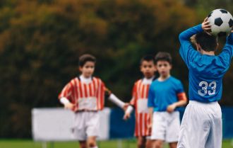 Warming up all of the muscles using hands to pass the ball like basketball