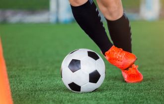 Warm up whilst improving ball skills by dribbling between cones and shooting at goal