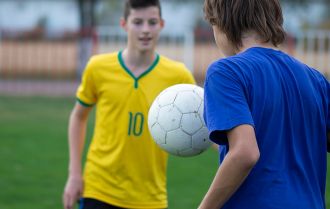 Player receiving the ball with their back to the goal