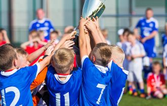 Winning Team Showing Off The Silverware
