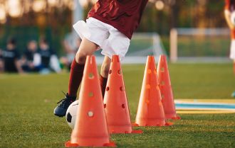 Players warm up for soccer trials
